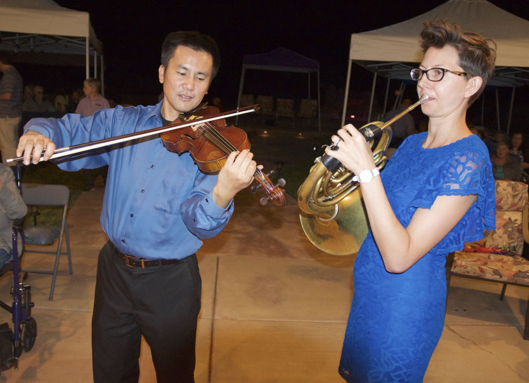 Sierra Vista Symphony Orchestra Artistic Director Toru Tagawa and Tucson Symphony Johanna Lundy perform an outdoor concert Saturday evening at the home of Cal and Mary Downing. The cancer, "Music at Twilight," is a kickoff fundraiser for the Sierra Vista Symphony's 23rd concert season.